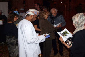 Guests enjoying their complimentary copy of 101 Things to See and Do in Oman