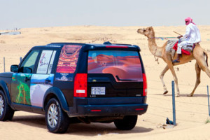 Passing slow moving traffic on the road across the Saudi desert