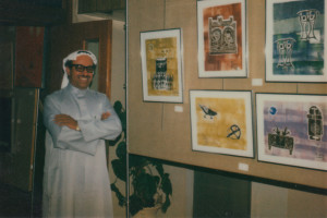 Nasser Al Yousif with some of his paintings